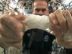 Numerical Simulation of Flow Field in Centrifugal Cone-shaped Two-phase Washing Machine under Microgravity